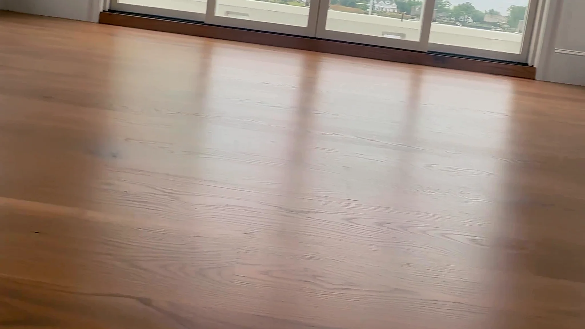 Hardwood floor in a family living room where pet stains are a common concern