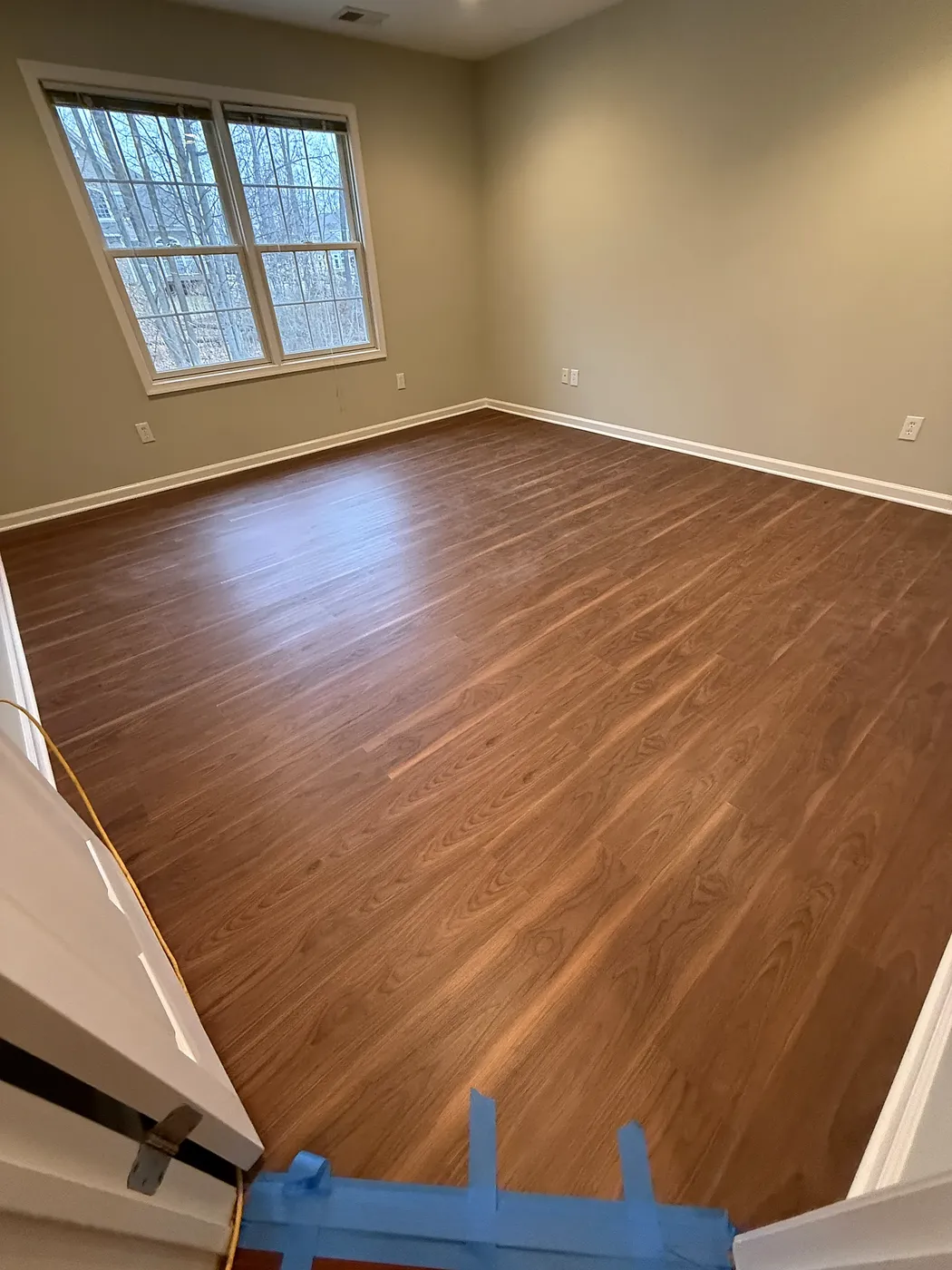 Warm-Toned LVP Bedroom Floor