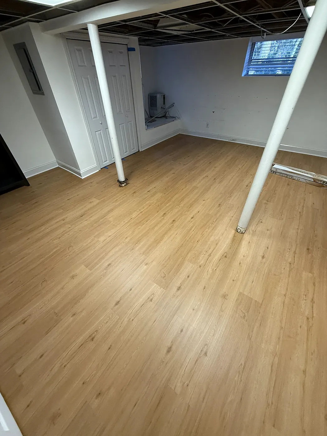 Basement LVP Flooring with Support Columns
