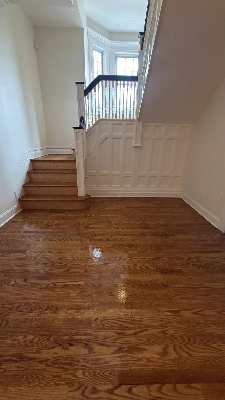 Refinished Stairwell Floor with Wainscot Trim